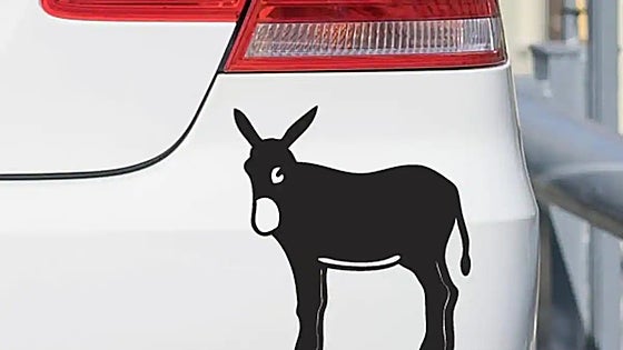What does the donkey sticker on the back of cars in Spain mean?
