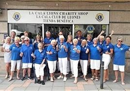 Members of La Cala Lions outside the charity shop.