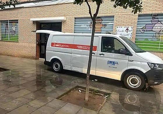 A funeral van at the scene of the incident.