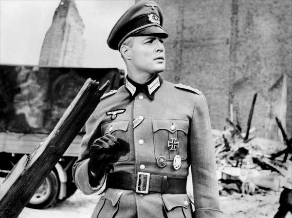 Brando in The Young Lions. On Tuesday 16 July, Marlon flew back to Paris to resume filming, He plays a Nazi soldier, which explains his blond hair in Malaga.