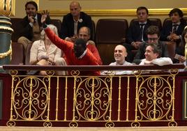 Agustín Ndour celebrates the vote in the public gallery on Tuesday.