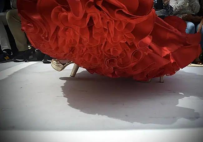 Frills swirling on the runway.