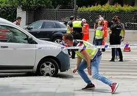 Police and medical staff at the scene of the crime.