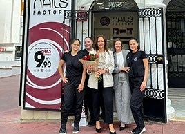 Teresa Jacobson with some of her staff outside her latest business venture in Arroyo de la Miel.