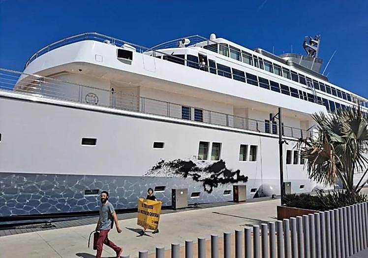 A spray-scratched mega-yacht in Port Vell.