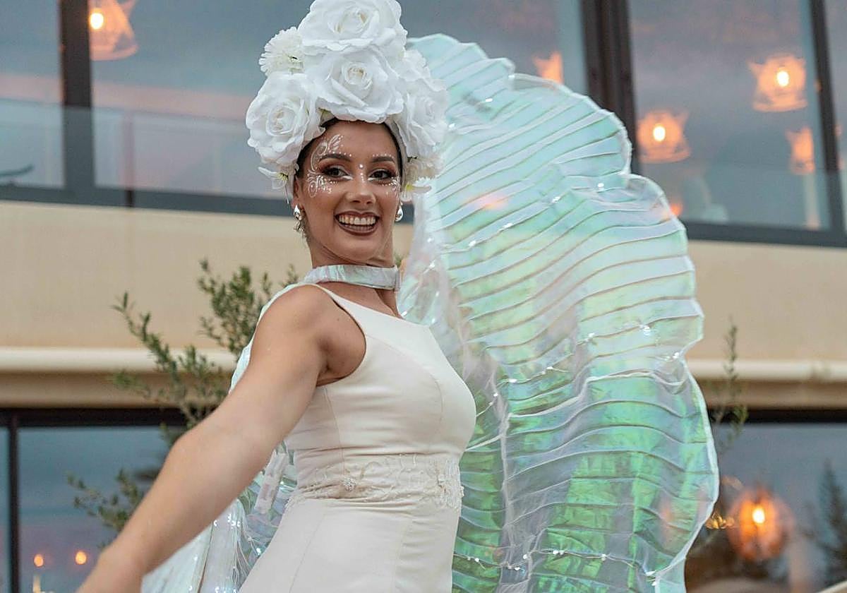 A colourful show of stilt walkers took place next to the pool.