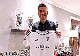 The 32-year-old Brazil midfielder poses with a Marbella shirt.