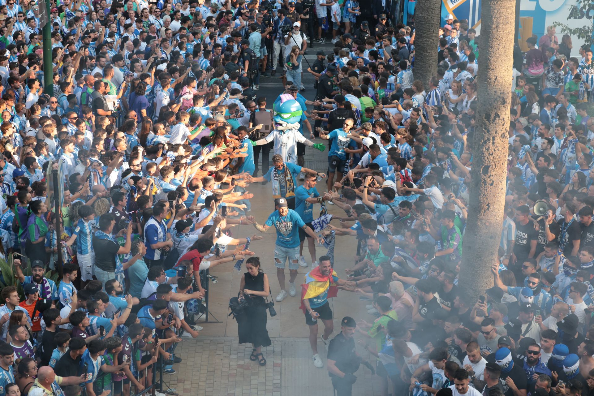 Fans celebrate Malaga CF's promotion as squad take open-top bus tour, in images