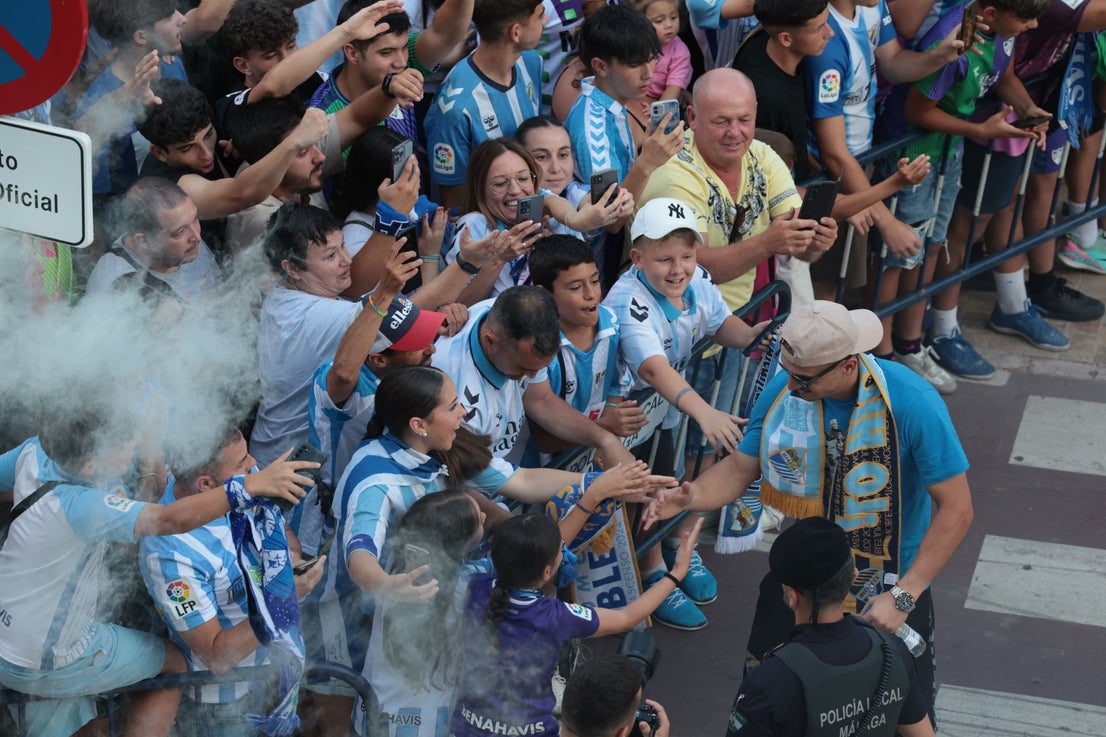 Fans celebrate Malaga CF's promotion as squad take open-top bus tour, in images
