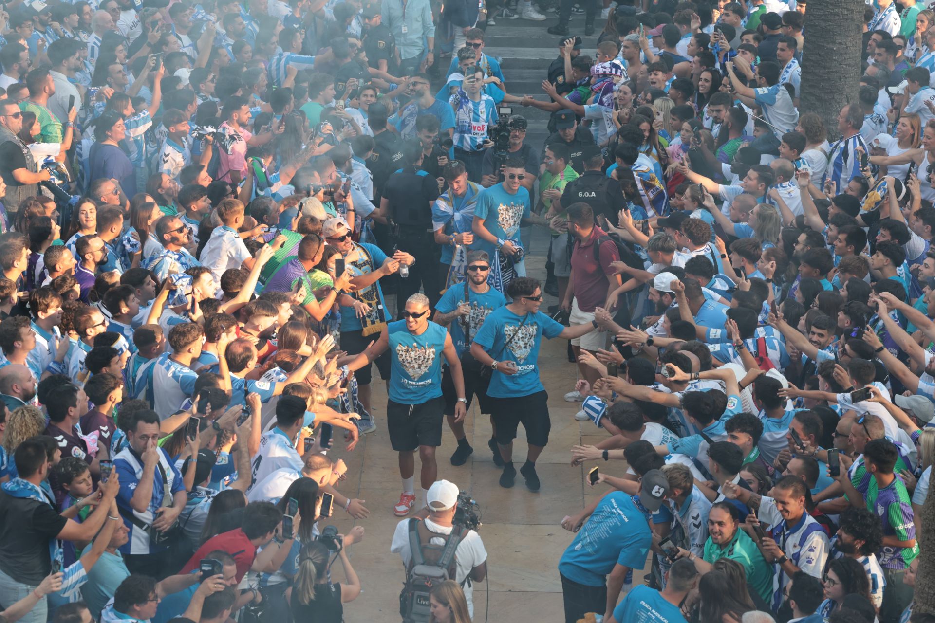 Fans celebrate Malaga CF's promotion as squad take open-top bus tour, in images