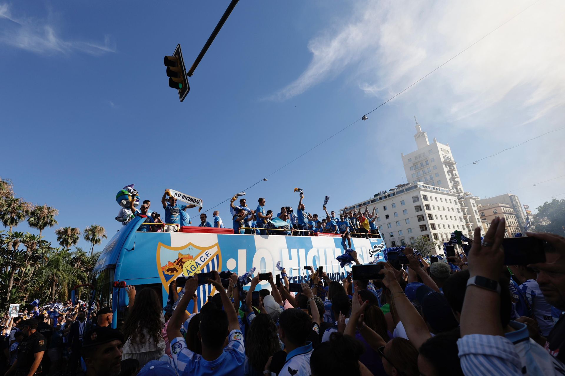Fans celebrate Malaga CF's promotion as squad take open-top bus tour, in images