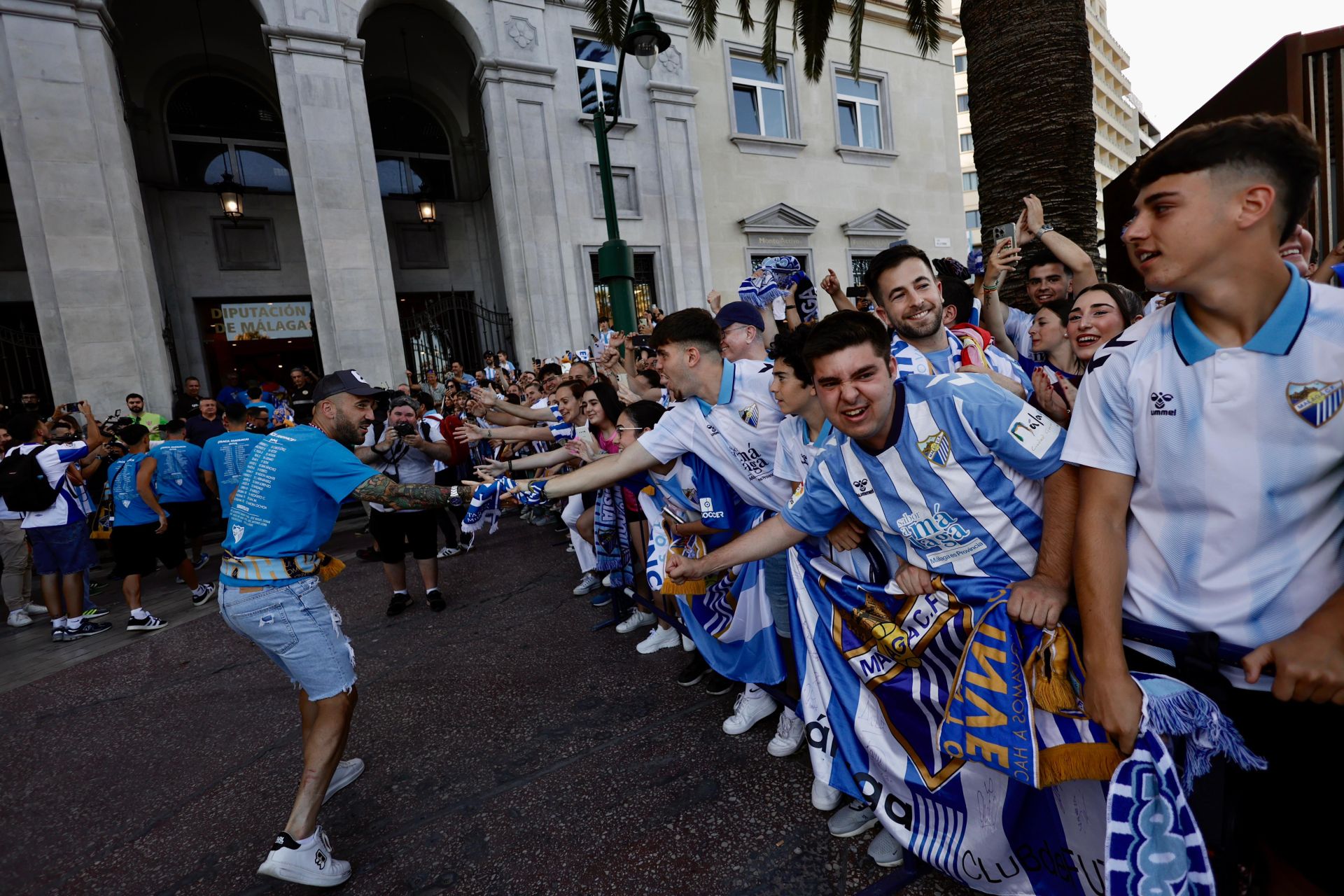 Fans celebrate Malaga CF's promotion as squad take open-top bus tour, in images