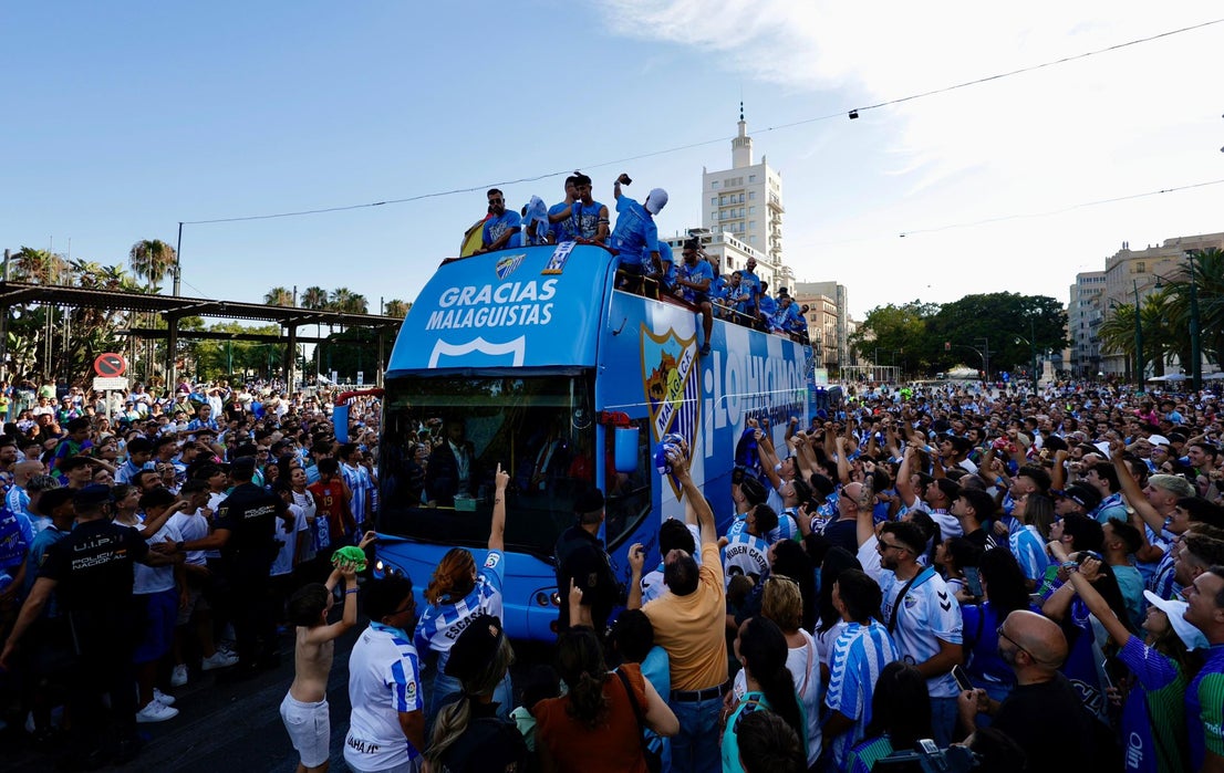 Fans celebrate Malaga CF's promotion as squad take open-top bus tour, in images