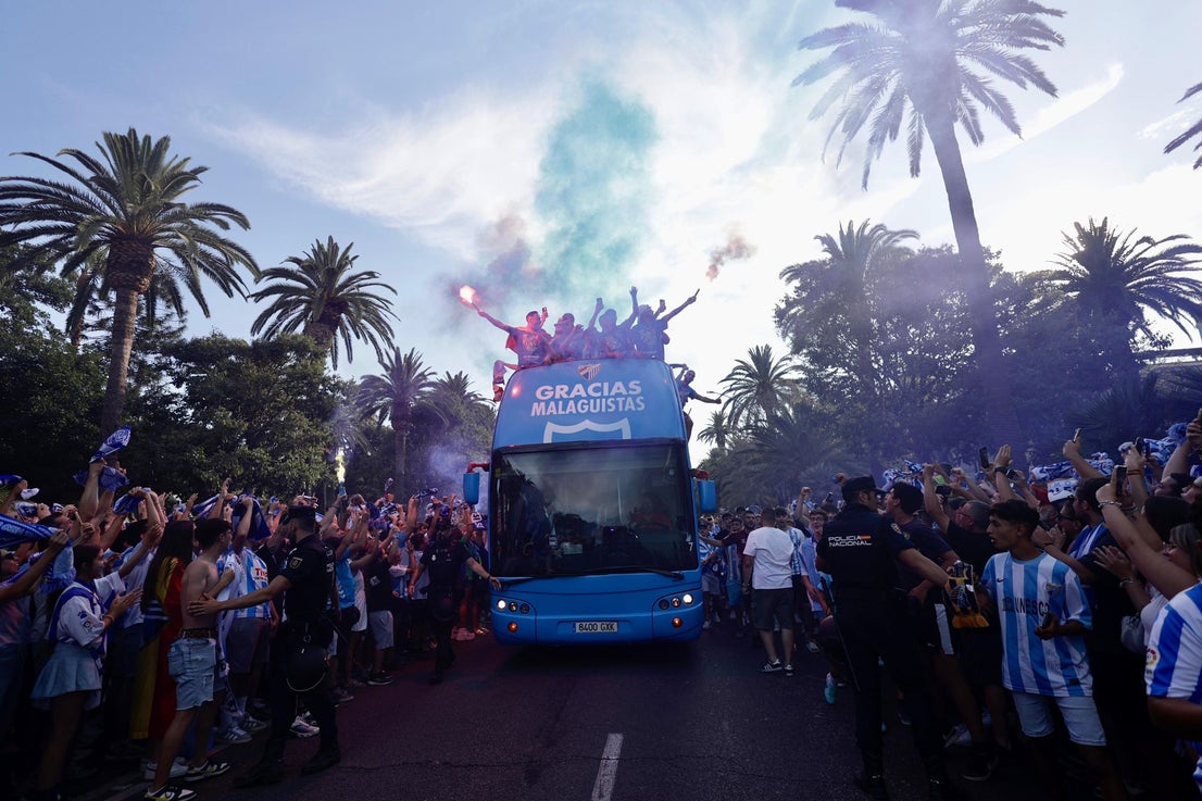 Fans celebrate Malaga CF's promotion as squad take open-top bus tour, in images