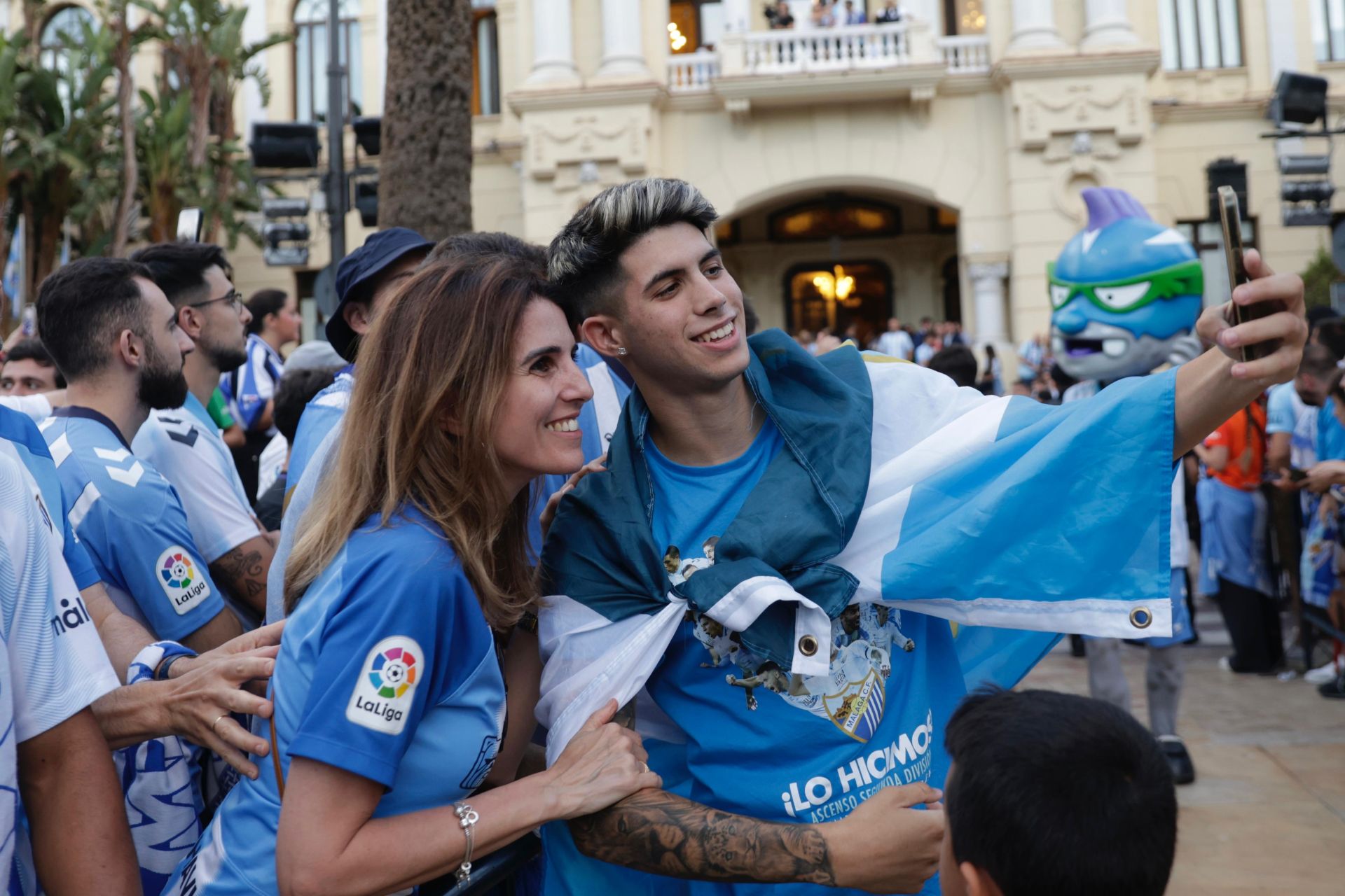 Fans celebrate Malaga CF's promotion as squad take open-top bus tour, in images