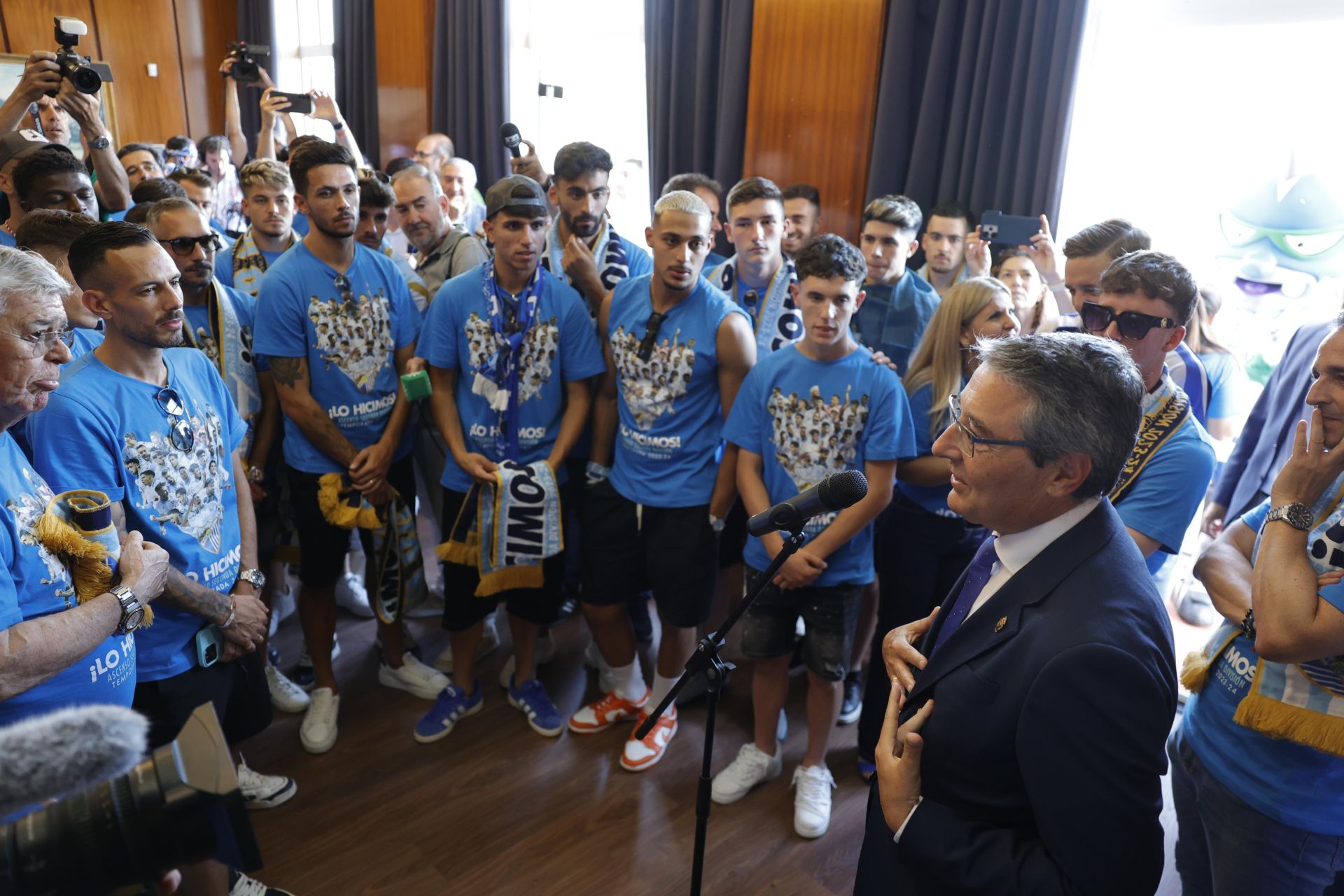 Fans celebrate Malaga CF's promotion as squad take open-top bus tour, in images