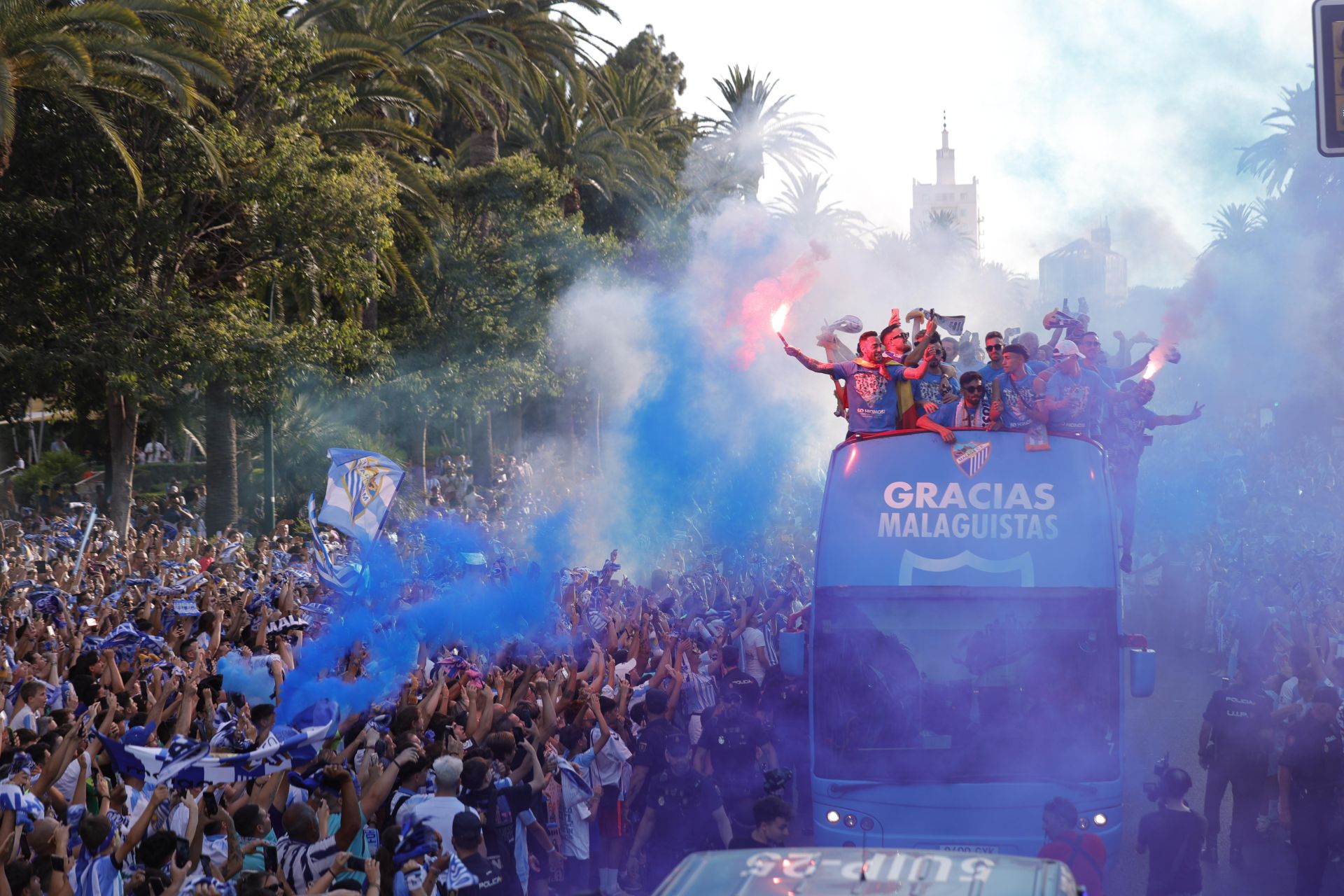 Fans celebrate Malaga CF's promotion as squad take open-top bus tour, in images
