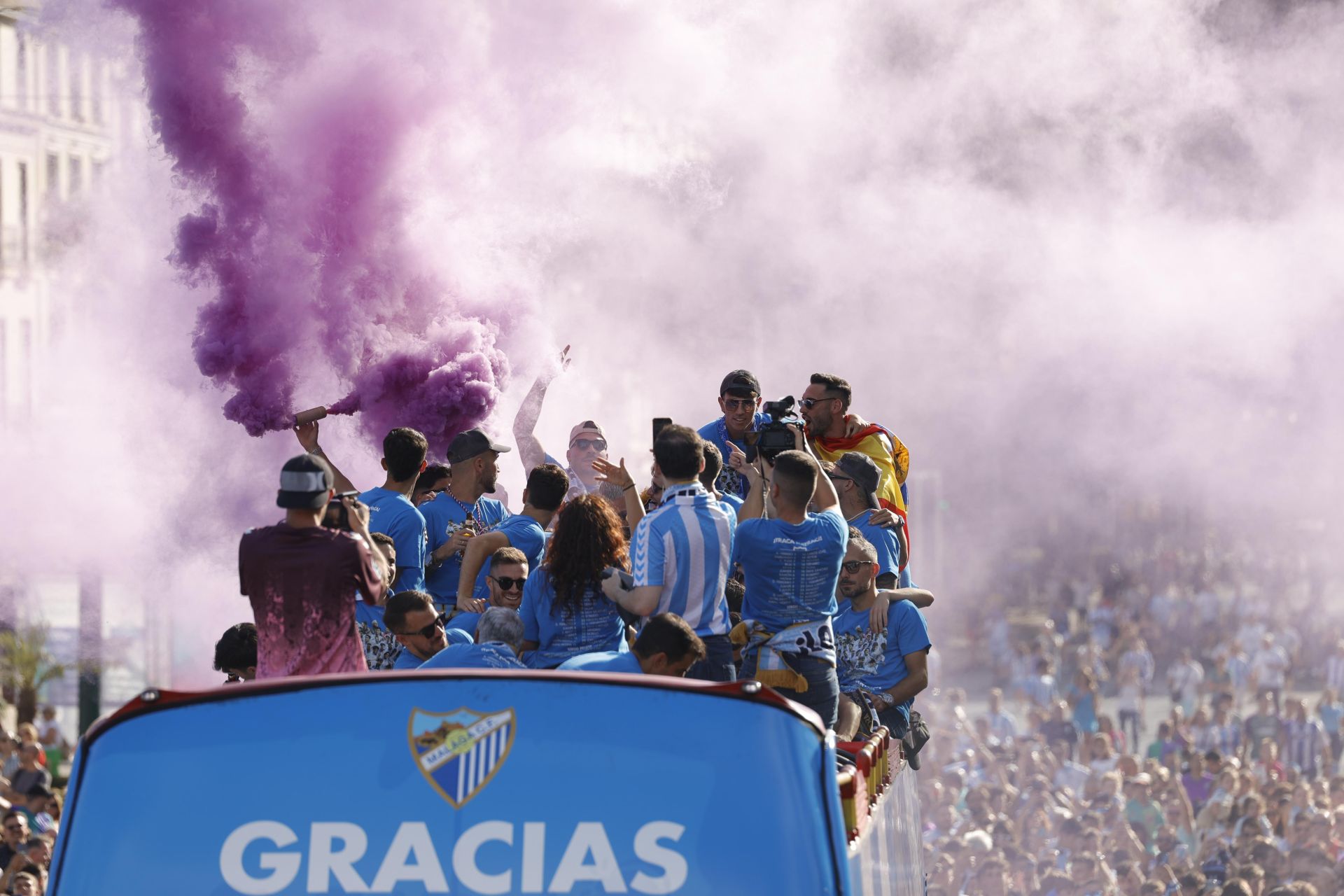 Fans celebrate Malaga CF's promotion as squad take open-top bus tour, in images