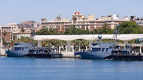 Why are two distinctive German naval warships moored in a prime area of Malaga port this week?