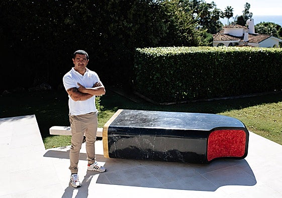 Sculptor Juan Miguel Quiñones, next to his most famous piece, the Dracula ice lolly.