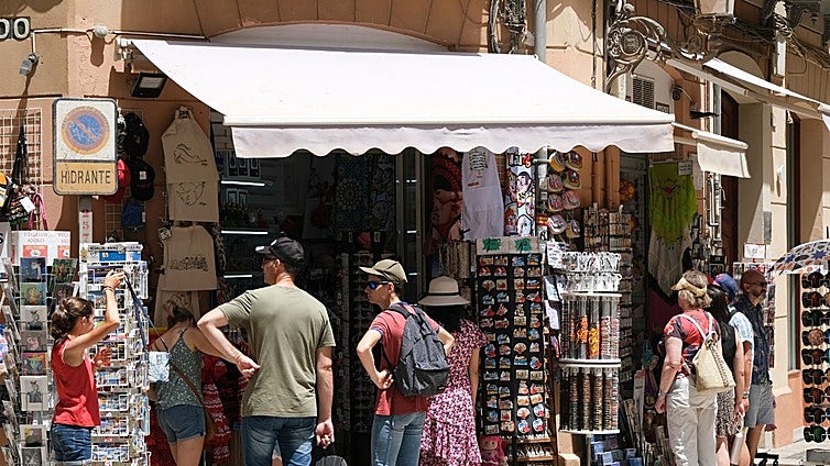 What do tourists spend most of their money on during a stay in Malaga and who are the biggest spenders?