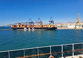 A large MSC cargo container ship, berthed in the port of Malaga.