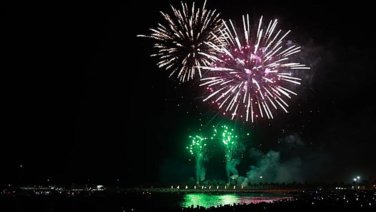 What time are the drone and firework displays that will signal the start of Malaga's annual fair on Friday?