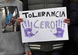Protest posters demanding zero tolerance of gender violence.