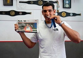 Ghadfa poses with his silver medal on his return to the Marbella gym where it all began.