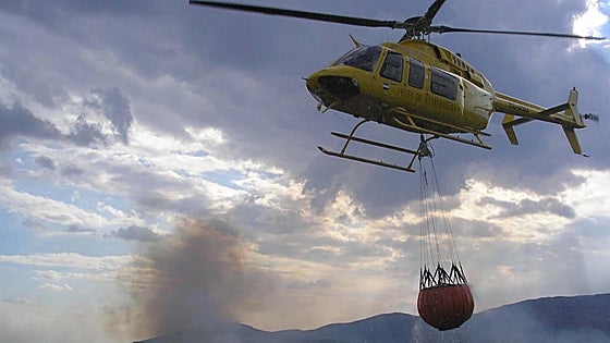 Elderly man dies after helicopter battling wildfire drops water on him in Spain