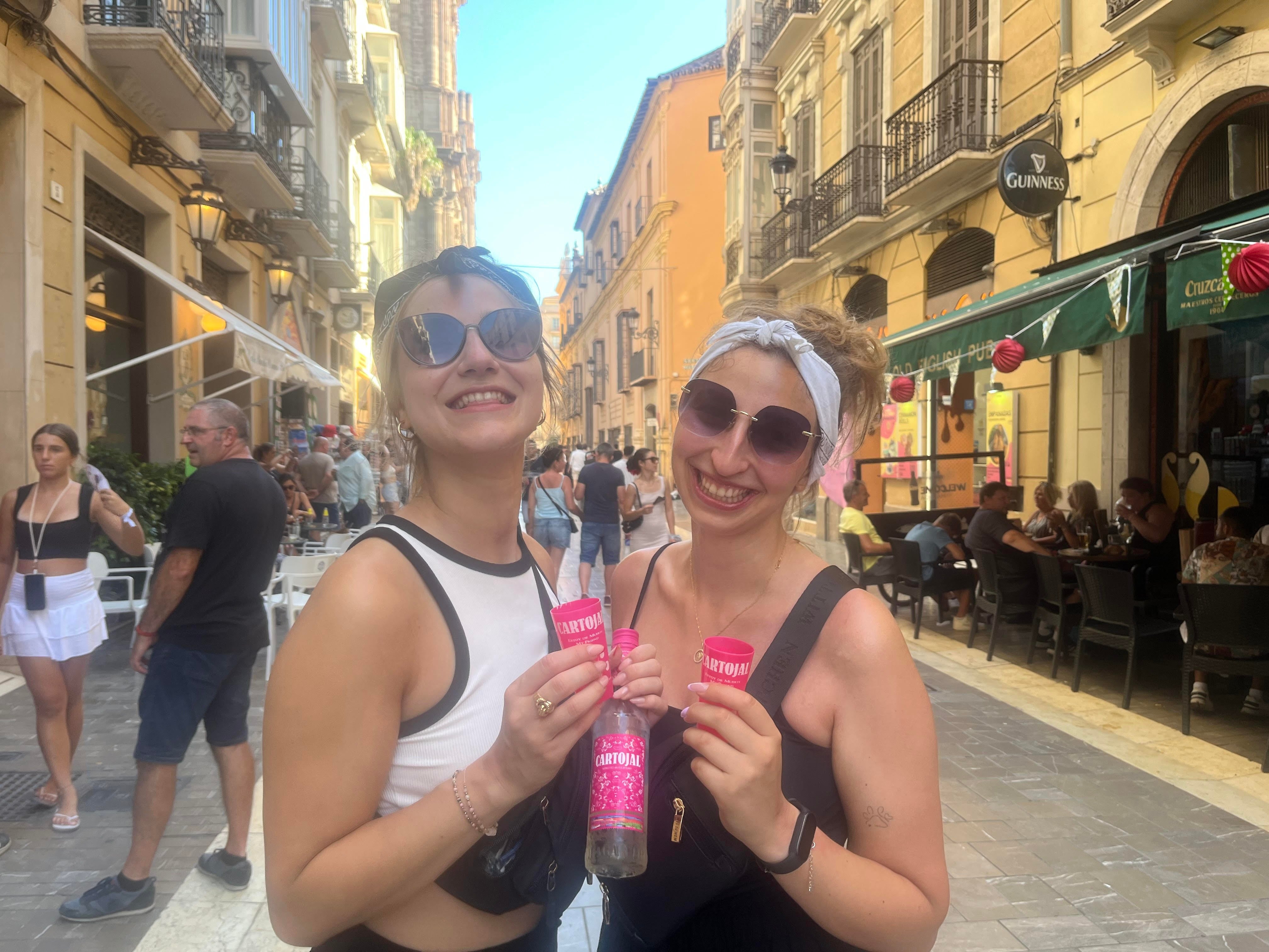 Ursula and Veronika, from Poland, pose with a bottle of Cartojal.