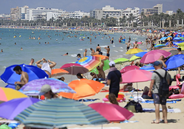 Bathers on a beach in Palma de Mallorca (Balearic Islands).