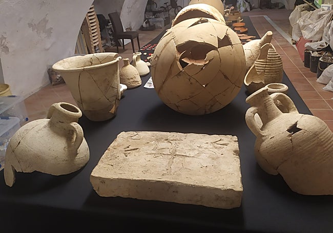 Remains from the Roman period, including well-preserved vessels and a floor with carved inscriptions.