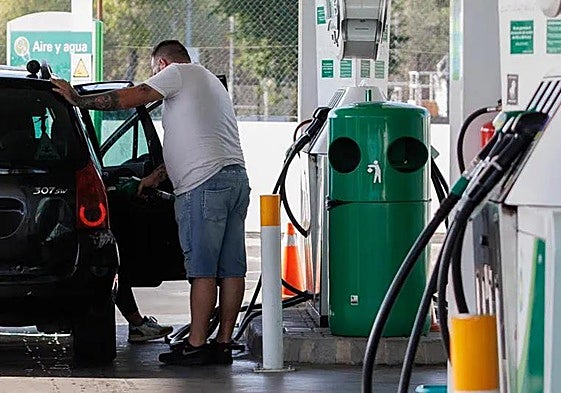 Motorist refuelling at a petrol station.