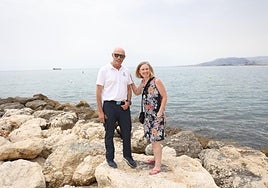 Alejandro and Victoria on the breakwater of the beach where she was rescued.