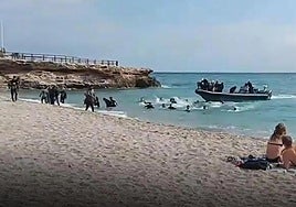The moment the boat dropped the migrants on the shore before speeding off.