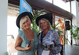 An ACE volunteer and one of the guests selling raffle tickets.