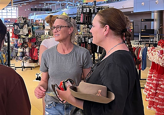Robin Wright, with a 20 euro note, before paying for some flip-flops she bought at the cruise terminal.