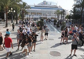 A group of tourists wander through the streets of Cadiz this summer.