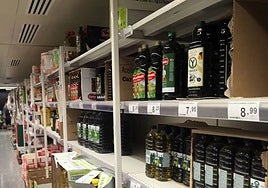 File image of a store shelf with olive oil on display.