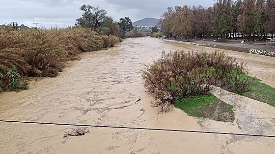 Flood warnings issued as major river is on verge of bursting its banks as downpours continue in Malaga