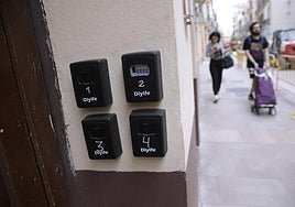 Boxes with tourist apartment keys in Calle Carretería in Malaga city centre.