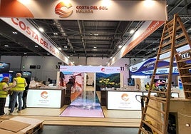 Workers finish setting up the Costa del Sol stand at the Excel venue for WTM in London, which opens today.