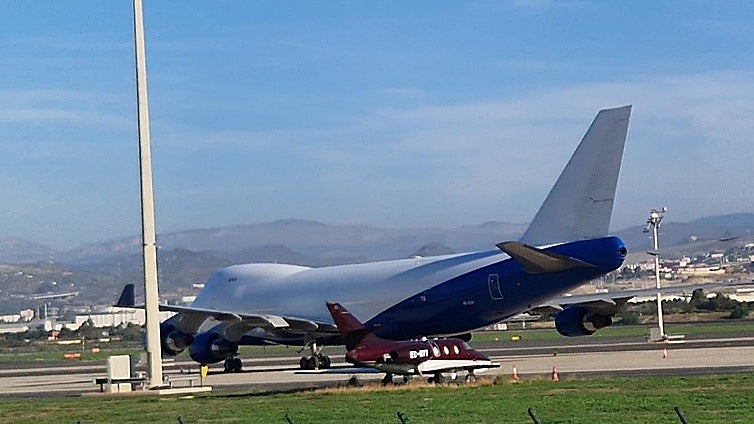 Who is the owner of the aircraft that is turning heads at Malaga Airport?