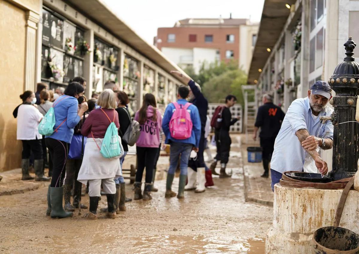 A burial coincides with the ongoing clean-up operation.