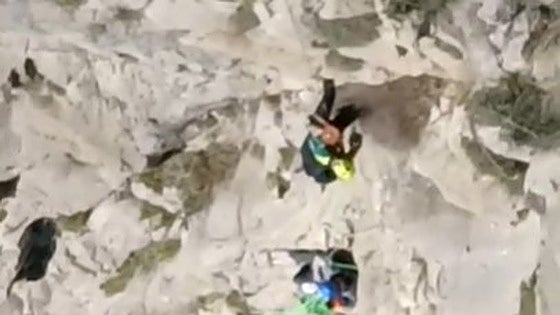 Video: young British climber rescued by helicopter after being left dangling by safety line some 200 metres up in the air in El Chorro