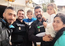 Two brave police officers rescue family trapped by rising flood water in their Malaga home