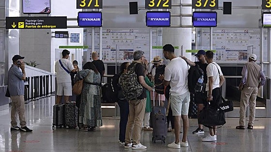Ryanair agrees to refund 55 euros to around 100,000 passengers for check-in charges it imposed at airports