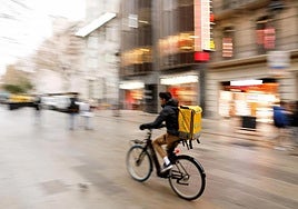 A Glovo food delivery driver in Barcelona.