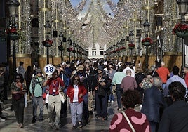 Calle Larios full of shoppers on a splendid Saturday morning.